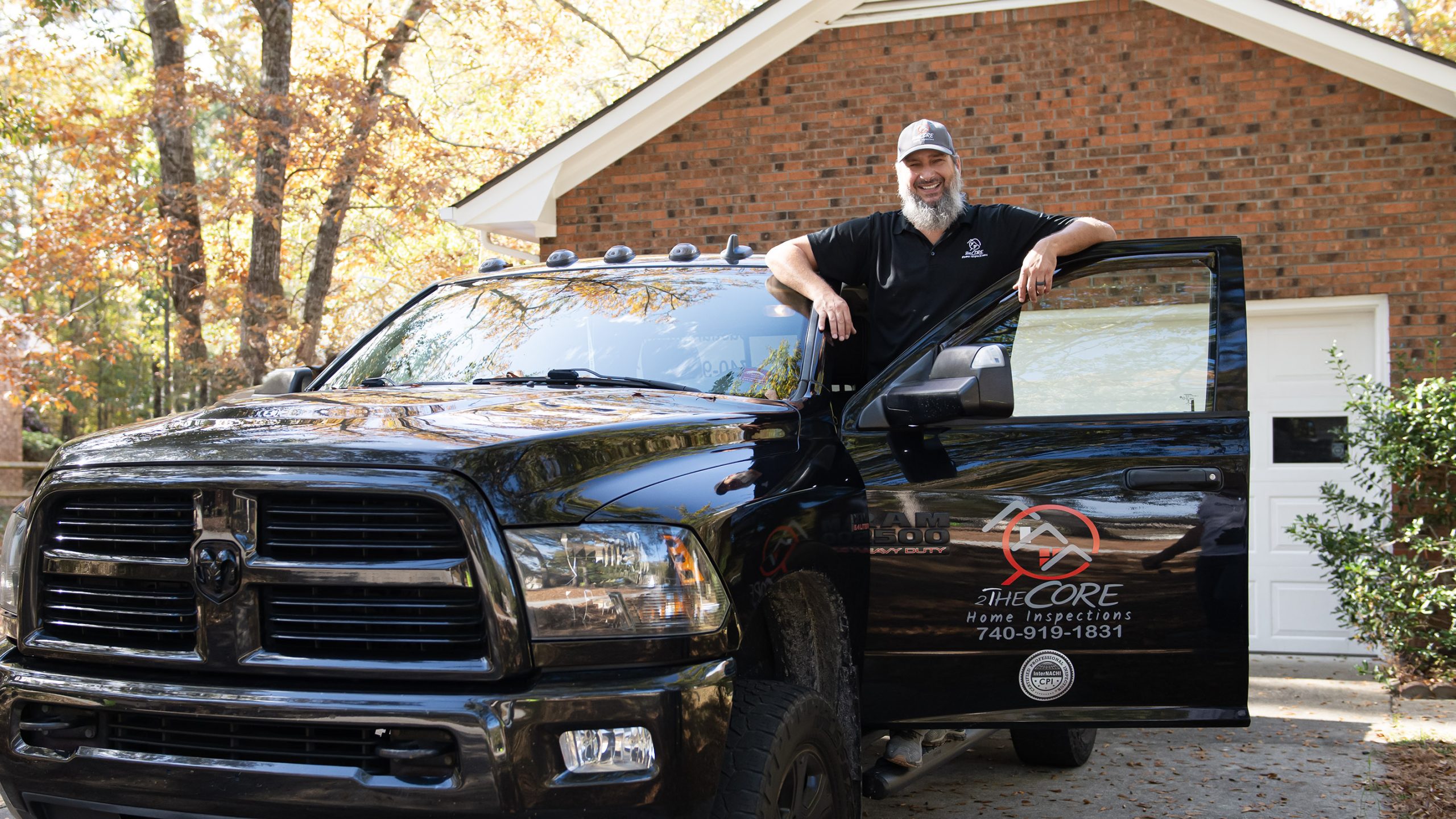 2theCore Home Inspector in front of his car